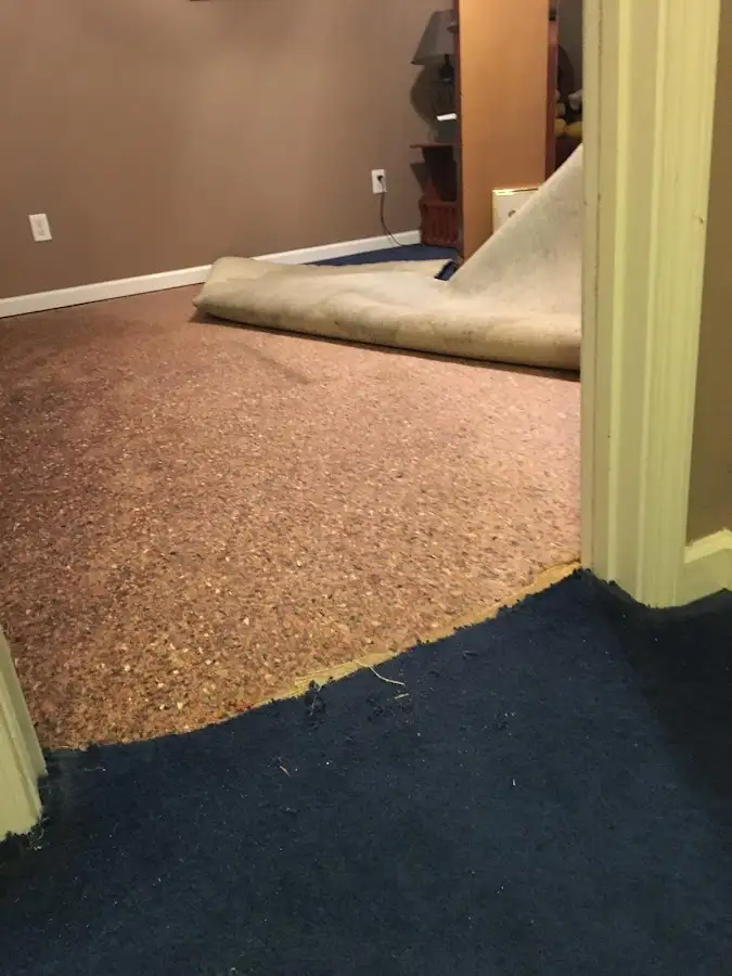 Carpet pad removal revealing water damage during Drying & Dehumidification in Prattville