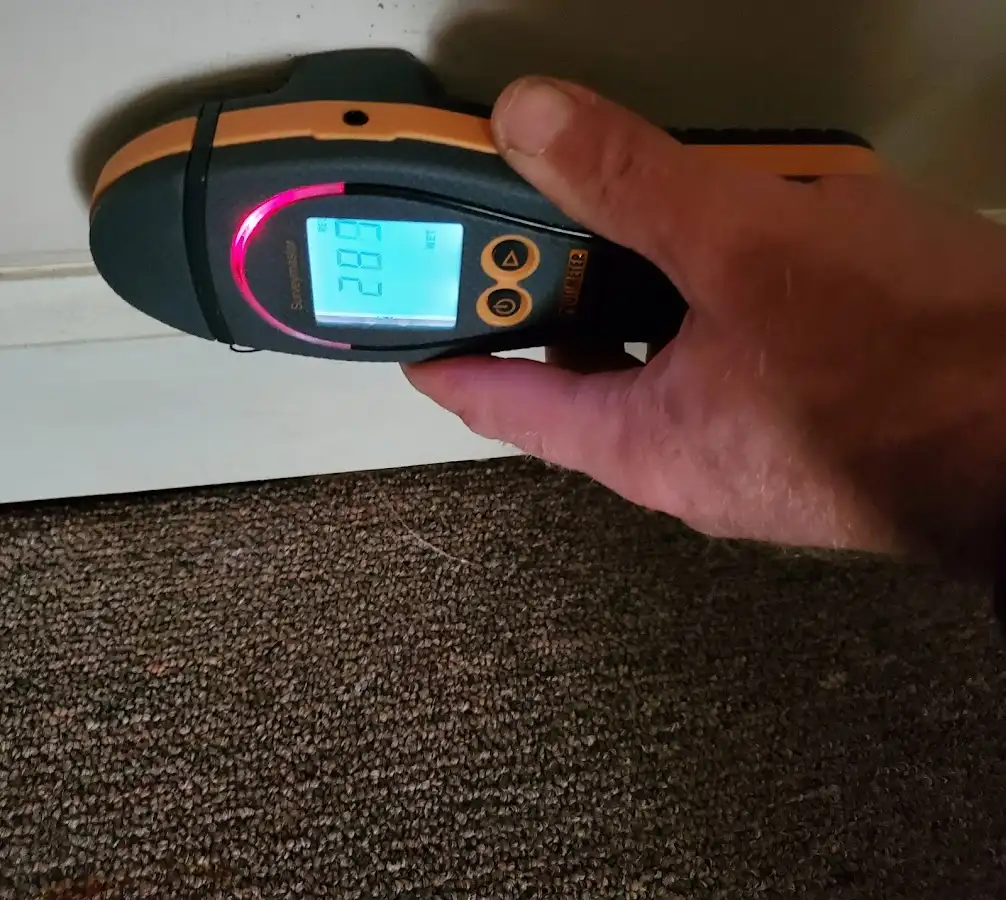 Moisture detection at baseboard during Storm Damage Restoration in Prattville